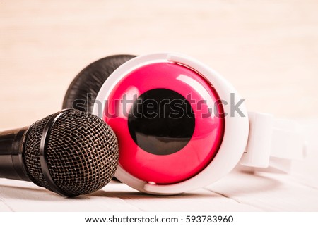 Music sound. Mic, microphone and headphone on radio, retro audio musical record studio. Vintage pop, rock broadcast equipment background. Karaoke voice.