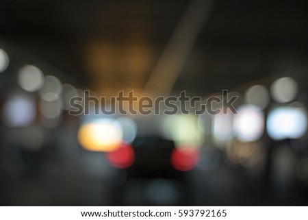 Blurred road of car in the Parking lot with light for background Abstract.
