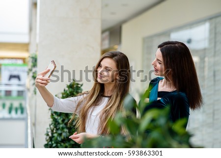 Girls make selfi at the Mall.