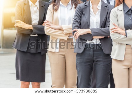 Success Teamwork Concept, Business people standing with arms crossed city background. Royalty-Free Stock Photo #593930885