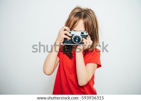 little girl with a camera