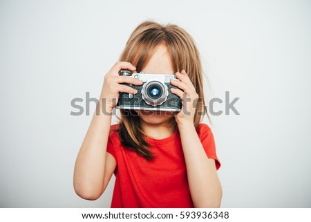little girl with a camera