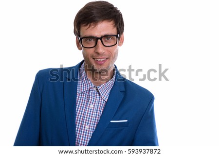 Studio shot of young happy businessman  smiling with eyeglasses