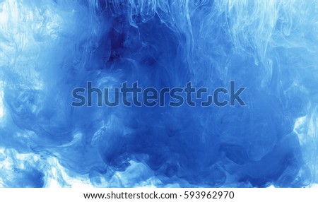 Abstract background color ink drop in water, motion swirling. Blue cloud of paint on white.