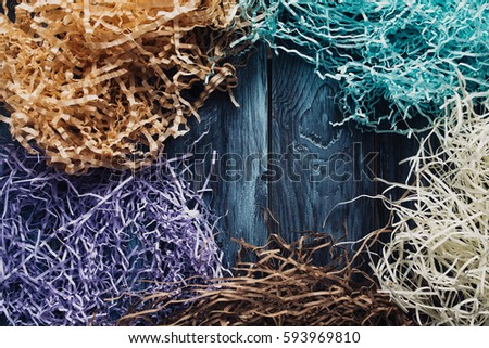 Decoration of colored paper on a wooden background