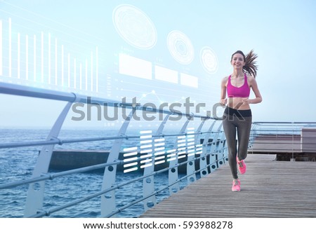 Heart rate monitor concept. Young woman running on pier