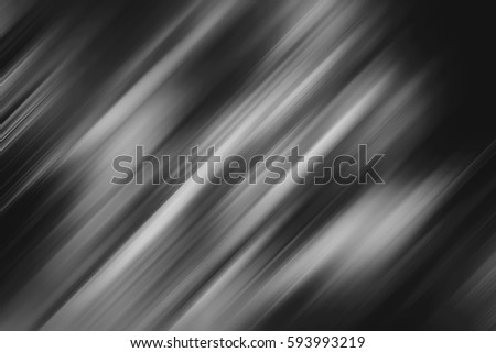 Abstract background with black lines at an angle of 45 degrees on a white background with motion blur effect