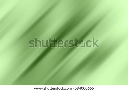 Abstract background with green lines at an angle of 45 degrees on a white background with motion blur effect