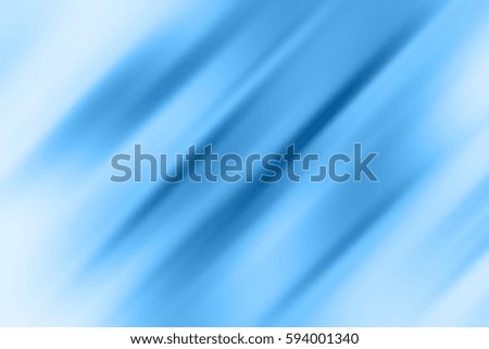 Abstract background with blue lines at an angle of 45 degrees, on a white background with motion blur effect