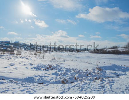 frozen river in winter on a Sunny day.