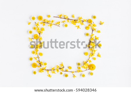 Flowers composition. Frame made of various yellow flowers on white background. Easter, spring, summer concept. Flat lay, top view, copy space