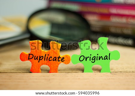 Puzzle with text duplicate and original Royalty-Free Stock Photo #594035996