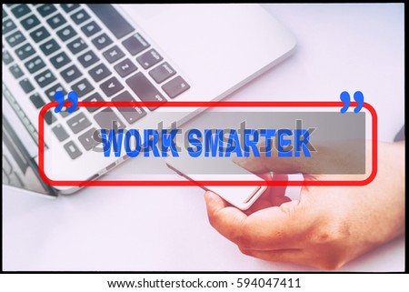 Hand and text  "WORK SMARTER" with vintage background. Technology concept.