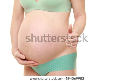 pregnant woman wearing underwear with thumbs up gesture??