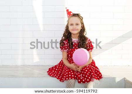 the little girl with balloon on a Children's birthday party