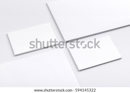 Photo of business cards isolated on white holding in hands. Business cards template for branding identity. Business cards For graphic designers presentations and portfolios. Branding, brand, template.