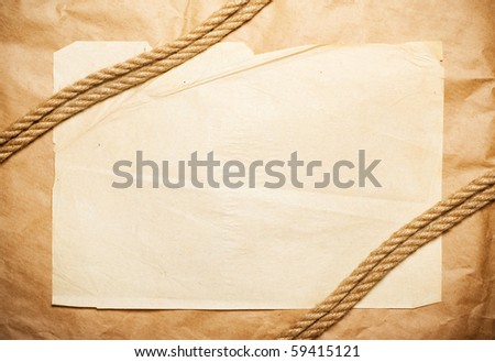 yellow paper background with rope over it