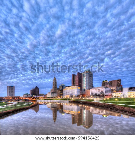 Evening Columbus Ohio skyline with thousands of clouds along the Scioto River at dusk