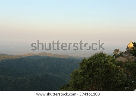 Nature  backgrounds/Dramatic clouds with mountain and tree: Mountain forests in Myanmar