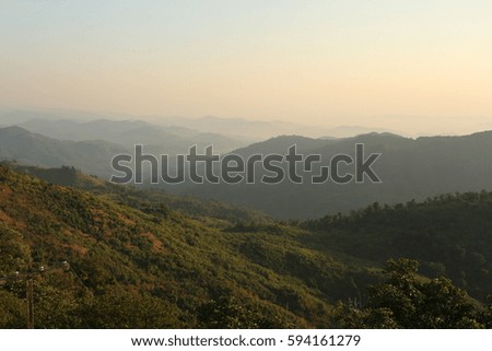 Nature  backgrounds/Dramatic clouds with mountain and tree: Mountain forests in Myanmar