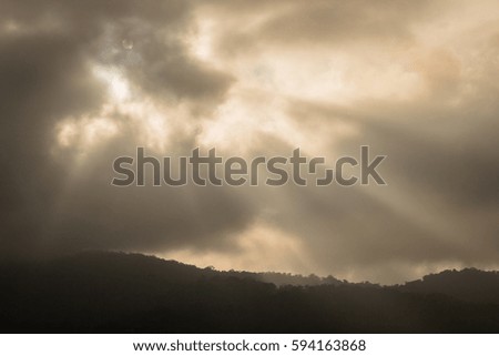 Sky with clouds at sun rays