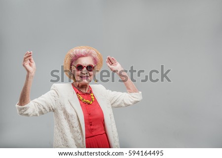 Cheerful modern middle aged female having fun time