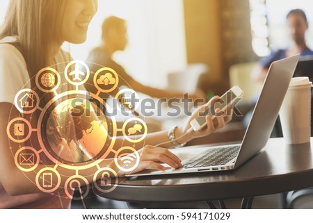 Woman use laptop and smartphone with IOT, internet of things conceptual sign, internet era, internet in every day lifes
