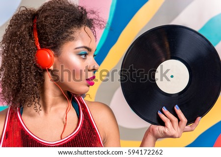 Calm woman hearing song through headset