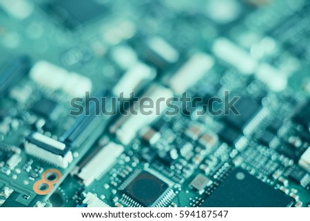 Blurred or De-focus Semiconductor chip on electronic circuit board for background.