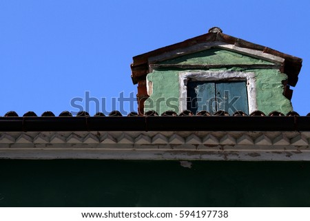 Architecture attraction in Burano Italy. Diverse Colored window and door. Mosaic frame editing