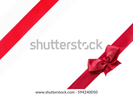 Red ribbon with bow isolated on white background .