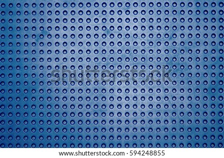 Background Plastic striped button blue color.