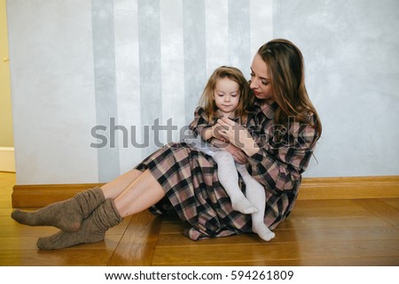 picture of beautiful young mother with adorable baby