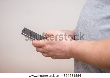 man holding a cellphone in hands