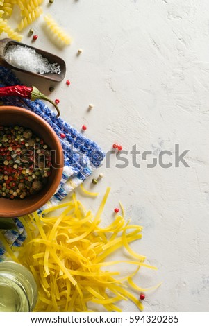 Bright picture with different varieties of pasta and Lasha. Spices and seasonings for cooking. Plenty of space for text.
