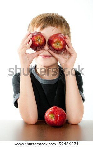 Child Holding Two Red Apples