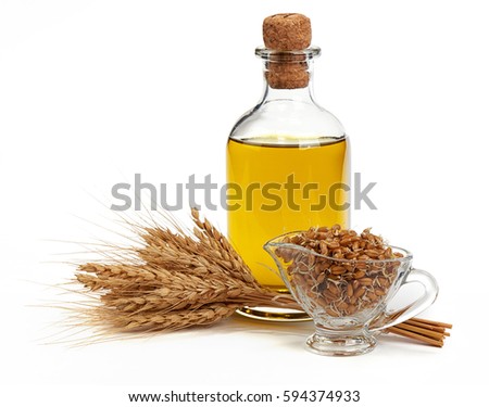 Glass bottle with Olive Oil, Ears of Wheat and Sprouted Wheat on a White Background Royalty-Free Stock Photo #594374933