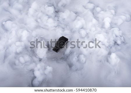 Flash memory stick in the clouds. Selective focus
