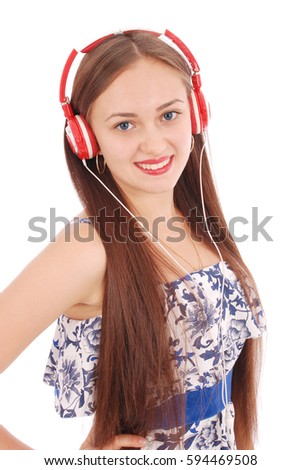 Pretty teenage girl listening music on her headphones isolated on white background