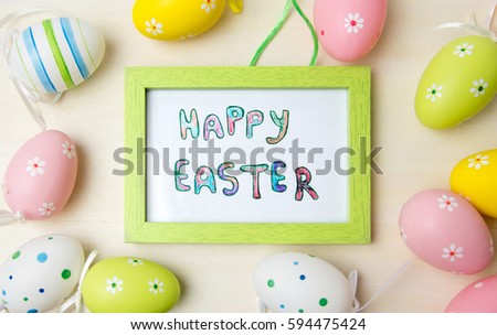 Happy Easter card in a wooden frame with colorful eggs