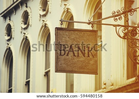 Bank sign and classic buildings - finance concept