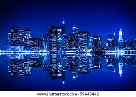 New York at night with reflection in water with blue hue