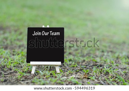 join our team word on wooden easel with flare effect
