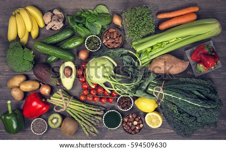 Alkaline foods above the wooden background Royalty-Free Stock Photo #594509630