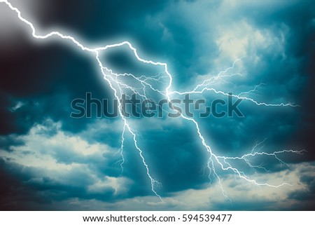 Lightning strike on the dark cloudy sky.