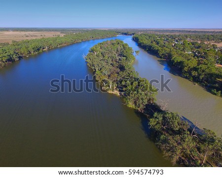 Aerial view of Murray Darling Junction with flood waters flowing in near Lock 10. Location Wentworth
 Royalty-Free Stock Photo #594574793