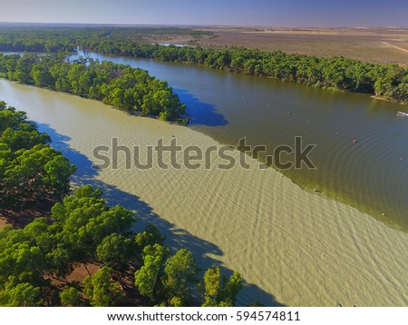 Aerial view of Murray Darling Junction with flood waters flowing in near Lock 10. Location Wentworth
 Royalty-Free Stock Photo #594574811