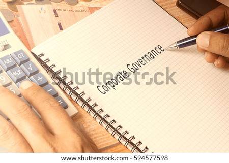 Hand writing on notepad. Business concept with conceptual text