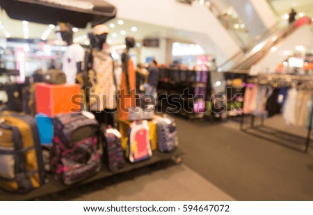 Abstract blurred event with people in shopping mall for background.