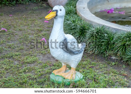 Duck statue in the home garden.